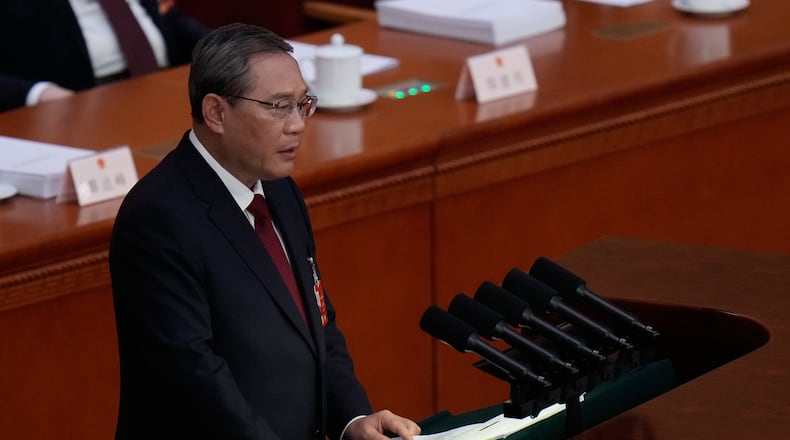 Chinese Premier Li Qiang speaks during opening session of the National People's Congress (NPC) in Beijing, Thursday, March 5, 2026. (AP Photo/Andy Wong)
