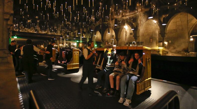 Candlesticks float and hover above the riders aboard Harry Potter and The Forbidden Journey in the new  Wizarding World of Harry Potter At Universal Studios Hollywood March 7, 2016. The newly completed attraction bringing J.K. Rowling's Harry Potter stories to life is scheduled to open April 7. (Mark Boster/Los Angeles Times/TNS)