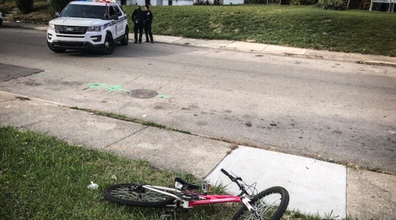 A bicyclist crashed into the back of a parked car Tuesday, Oct. 30, 2018, on Kammer Avenue in Dayton.