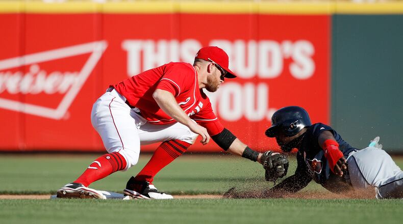CINCINNATI, OH - JUNE 03: Zack Cozart #2 of the Cincinnati Reds tags out Brandon Phillips #4 of the Atlanta Braves as he tries to steal second base in the sixth inning of a game at Great American Ball Park on June 3, 2017 in Cincinnati, Ohio. The Braves defeated the Reds 6-5 in 12 innings. (Photo by Joe Robbins/Getty Images)