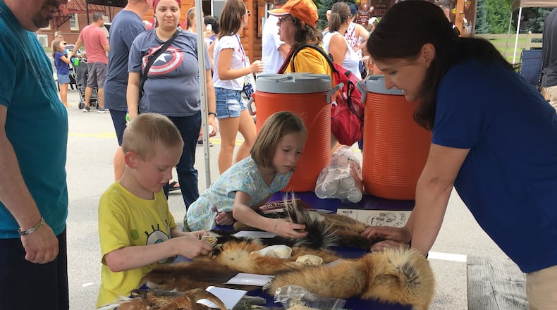 The park district had a hands-on learning booth for kids at the Americana Festival. Thousands attended the Centerville Washington Township Americana Festival, Thursday, a local 4th of July tradition. KATIE WEDELL/STAFF