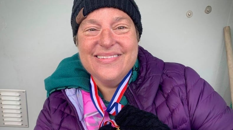 Amy Wamsley of Yellow Springs with her medal recognizing her solo swim across the English Channel in June. Photo courtesy of Amy Wamsley