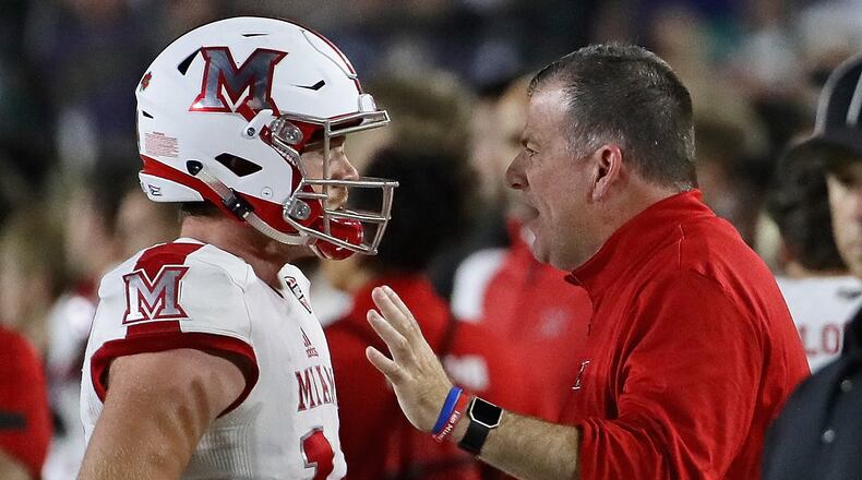 Head coach Chuck Martin of the Miami Redhawks talks to quarterback Gus Ragland on the sidelines during a game against the Notre Dame Fighting Irish at Notre Dame Stadium on September 30, 2017 in South Bend, Indiana. (Photo by Jonathan Daniel/Getty Images)