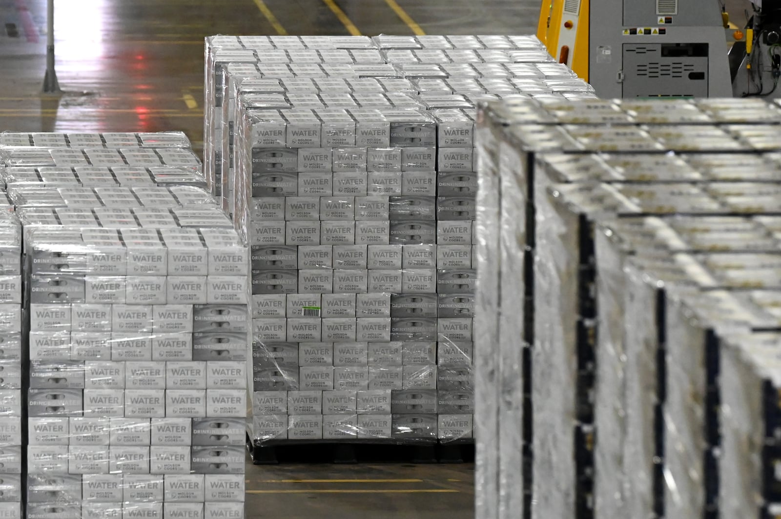 Once a year, Molson Coors in Trenton produces canned water to distribute to disaster areas around the country. This year, the Trenton brewery has doubled its output to between 600,00 to 800,000 cans of water. It cans the water in a single day in April, but this year they delayed the run due to storms and tornado activity in the area. Pictured is part of the canning process done on May 12, 2025. MICHAEL D. PITMAN/STAFF