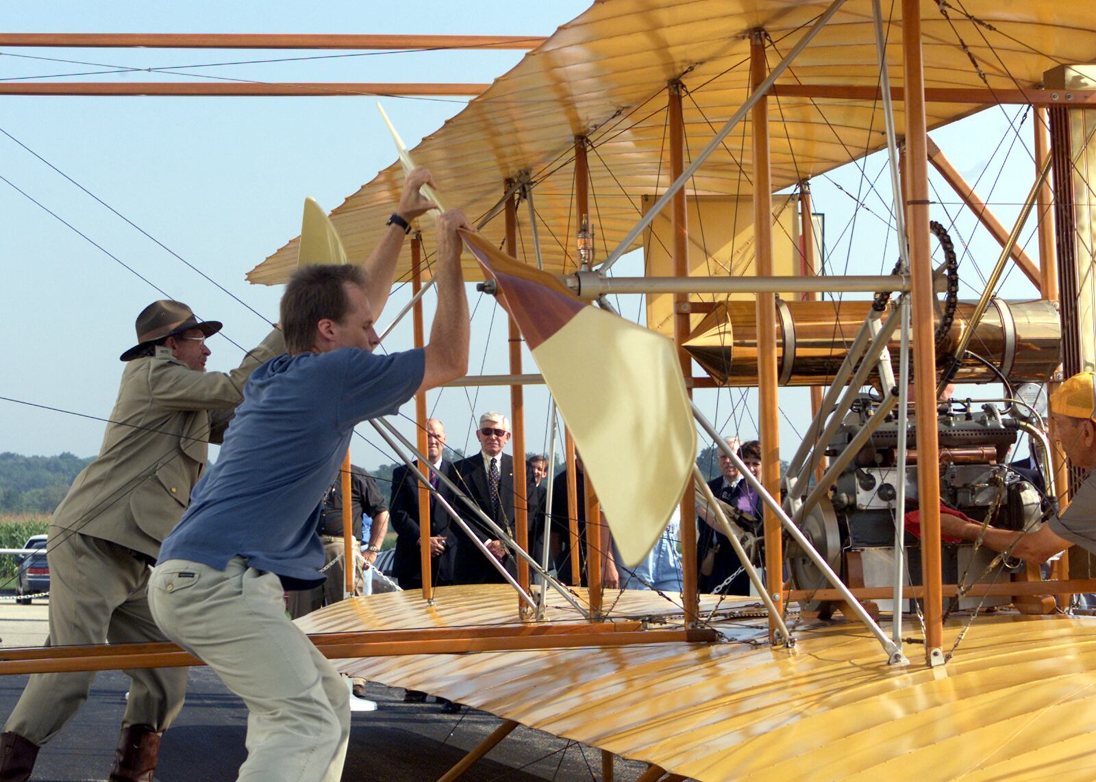 8/25/01 The Wright "B" Flyer replica is prepared for starting by its builder Tom Valentine, (right center) and members of Wright B Flyer, Inc. at the dedication ceremony.