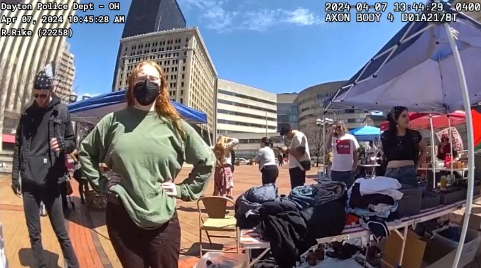 Community members gave out food and other items at Courthouse Square in downtown on April 7, 2024. Police arrested a 25-year-old man for distributing food after the group was warned they could not give out food and items without a city permit. This image is from body camera footage of the incident. CONTRIBUTED