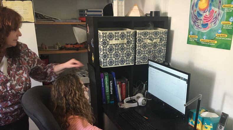 Online education provides both flexibility and challenges. Lillian Connolly of Kettering attended the Ohio Connections Academy, studying at home with guidance from her mother Shelley. JEREMY P. KELLEY / STAFF