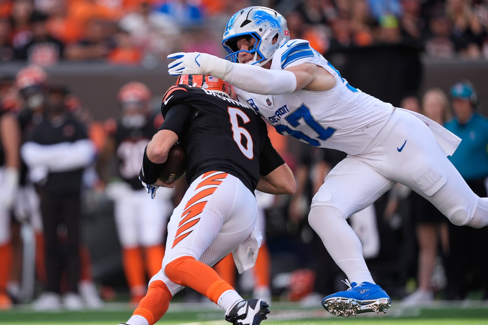 Detroit Lions defensive end Aidan Hutchinson (97) sacks Cincinnati Bengals quarterback Jake Browning (6) which was nullified for an offsides penalty during the first half of an NFL football game Sunday, Oct. 5, 2025, in Cincinnati. (AP Photo/Carolyn Kaster)