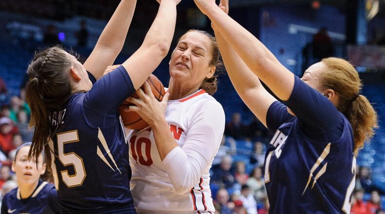 Dayton’s Andrijana Cvitkovic (right) shoots with pressure from Quinnipiac’s Morgan Manz (left) and Jay Fen (right) during a nonconference game against Quinnipiac on Sunday, November 13, 2016 at U.D. Arena. Contributed Photo by Bryant Billing