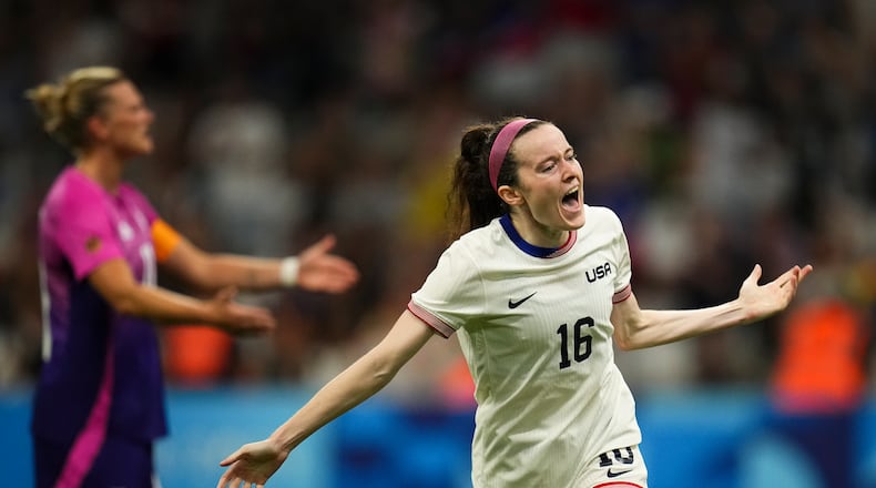 United States' Rose Lavelle celebrates after teammate Mallory Swanson scored their side's second goal, during the women's Group B soccer match between the United States and Germany at the Velodrome stadium, during the 2024 Summer Olympics, Sunday, July 28, 2024, in Marseille, France. (AP Photo/Daniel Cole)