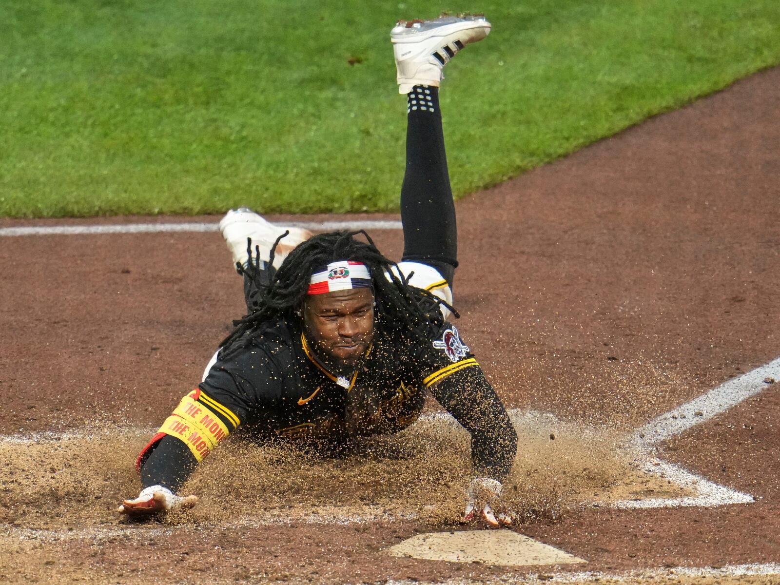 Pittsburgh Pirates' Oneil Cruz scores from second on a single by Bryan Reynolds off Cincinnati Reds pitcher Nick Martinez during the sixth inning of a baseball game in Pittsburgh, Tuesday, May 20, 2025. (AP Photo/Gene J. Puskar)