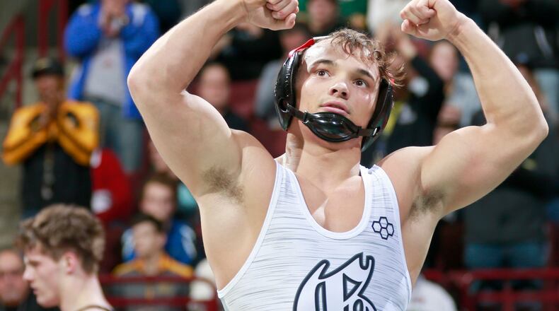 Graham 145-pounder Mitch Moore won his fourth D-II state title during last month’s OHSAA State Wrestling Tournament at Value City Arena in Columbus. BARBARA J. PERENIC / COLUMBUS DISPATCH