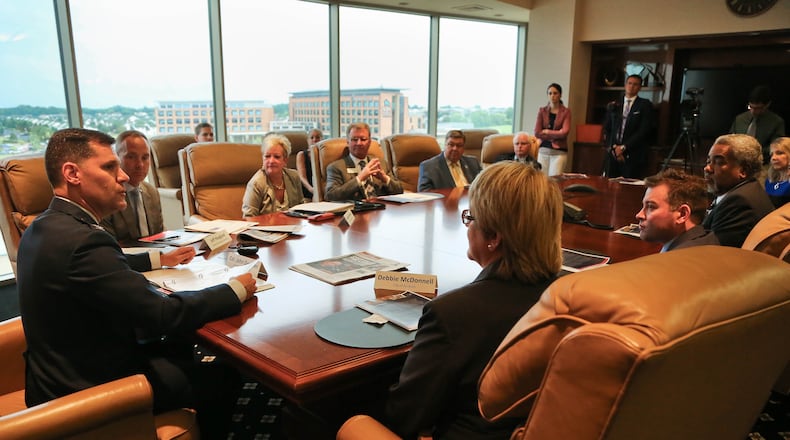 The Dayton Development Coalition and other local leaders are looking for good ideas for the region, including ideas on how to strengthen Wright Patterson Air Force Base. In this June 2015 file photo, base commander Col. John M. Devillier, left, speaks during a press conference at Pentagon Tower in Beavercreek. JIM WITMER/STAFF