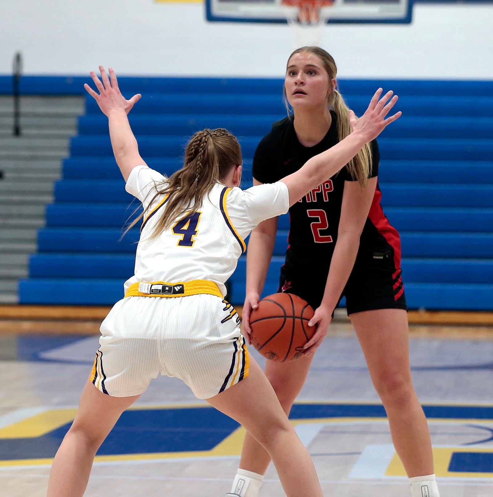 Tippecanoe sophomore Abbi Mader scans the floor while being guarded by Butler freshman Alexa Moeller. Tippecanoe defeated Butler 49-32 in a Division III district semifinal on Wednesday, Feb. 25, 2026, in Springfield. STEVEN WRIGHT / STAFF