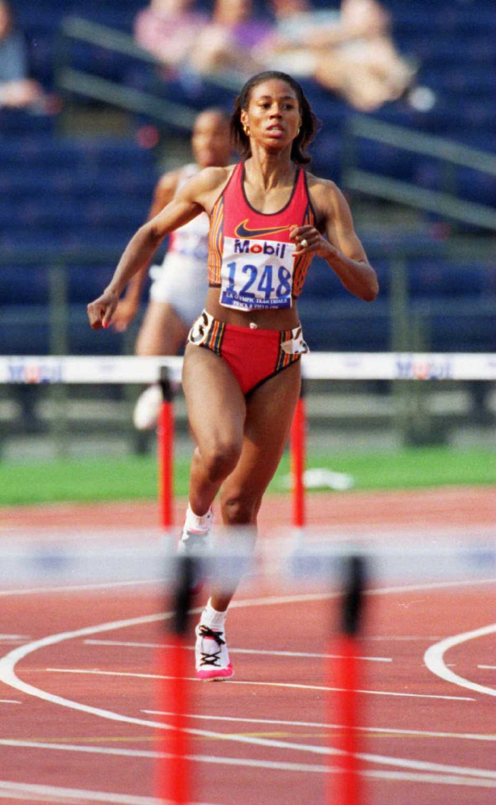 ***FROM THE TRACK & FIELD TRIALS ON 6-22-96*** Tonya Buford-Bailey runs the curve between hurdles in a heat of the 400m Hurdles. AJC PHOTO