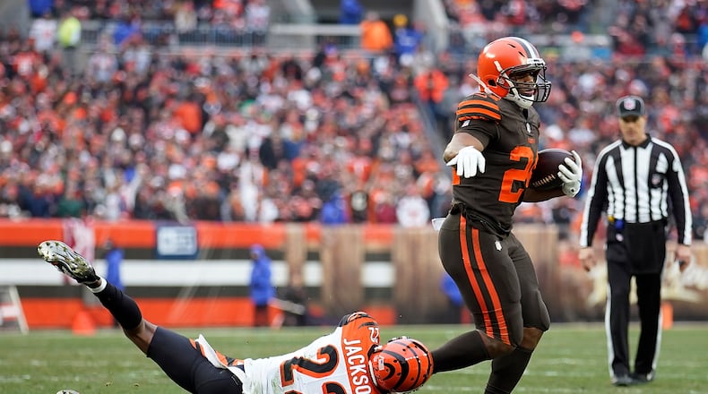 Nick Chubb of the Cleveland Browns avoids a tackle by William Jackson of the Cincinnati Bengals during the second quarter at FirstEnergy Stadium on December 23, 2018 in Cleveland, Ohio. (Photo by Kirk Irwin/Getty Images)