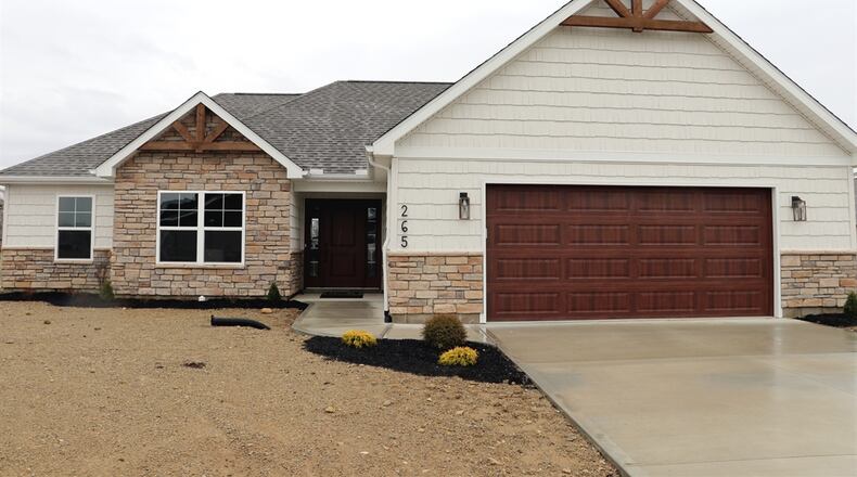 The new construction at 265 Fox Harbor Drive has about 1,762 square feet of living space. Built in 2023 by S.M. O’Neal Construction, the stone-and-vinyl ranch has craftsman-style gable truss accents and a stained overhead door to the two-car garage. A concrete driveway leads to a concrete walkway to the covered entry nook. Landscaping and sod will be added in spring. CONTRIBUTED