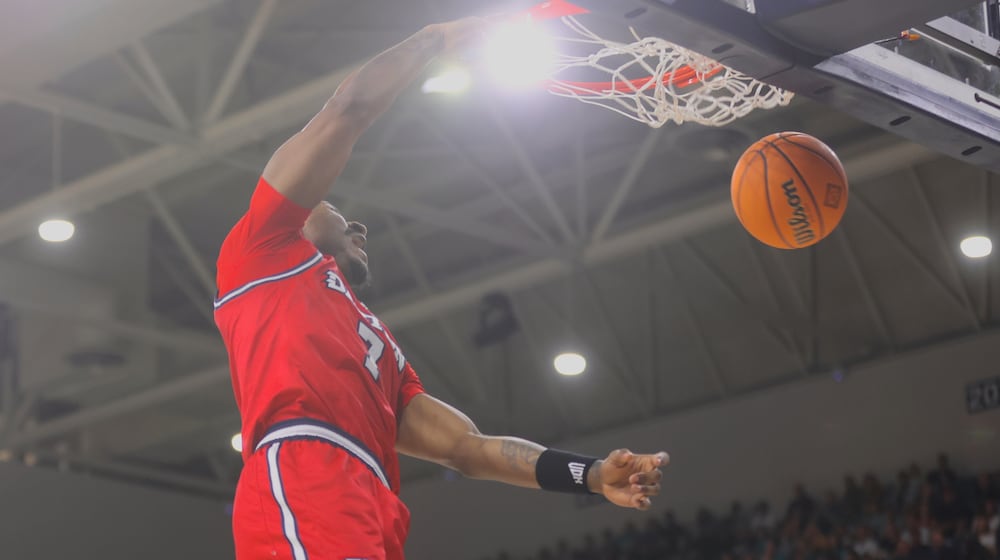 Dayton's Keonte Jones dunks against North Carolina Wilmington in the first round of the National Invitation Tournament on Saturday, March 21, 2026, at Trask Coliseum in Wilmington, N.C.. David Jablonski/Staff
