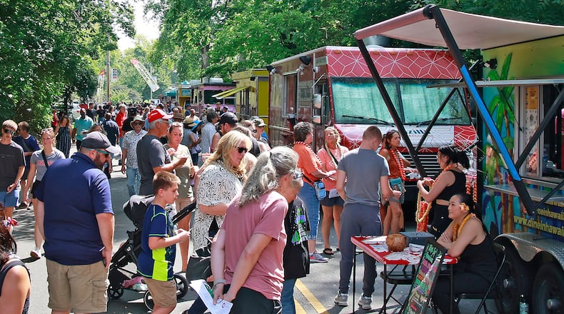 A crowd of hungry people filled Veterans Park Saturday, August 17, 2024 for the 10th annual Springfield Rotary Gourmet Food Truck Competition. BILL LACKEY/STAFF