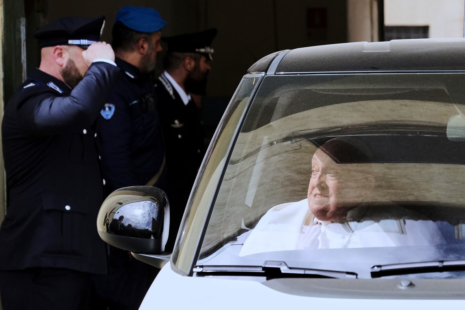 Pope Francis leaves in a car at the end of his visit on Holy Thursday to the Regina Coeli penitentiary in Rome, Thursday, April 17, 2025. (AP Photo/Andrew Medichini)
