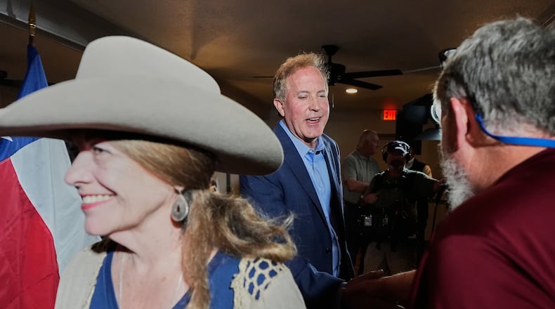 Texas Attorney General Ken Paxton, a Republican candidate for the U.S. Senate, greets supporters during a campaign stop, in Waco, Texas, Monday, March 2, 2026. (AP Photo/Tony Gutierrez)