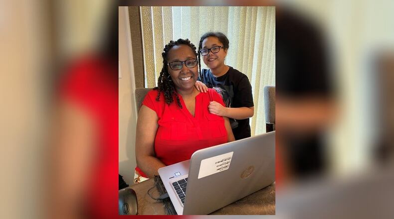 Staff of the Airman & Family Readiness Center at Wright-Patterson Air Force Base continue to provide programs and services during the COVID-19 pandemic, but these resources are delivered in a different way as the staff currently teleworks. Shown working from home is Shonté Gonzalez with Brooklyn. (Contributed photo)