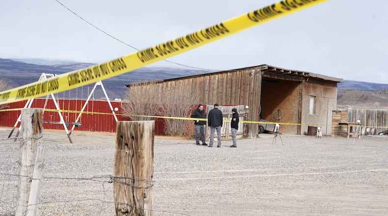 Authorities conduct an investigation at a home where a woman was found dead in Lyman, Utah, Thursday, March 5, 2026. (AP Photo/George Frey)