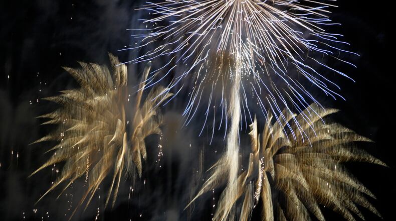 Fireworks by the City of Dayton mark the end of the Cityfolk Festival and a highlight of the holiday weekend for thousands in downtown Dayton at RiverScape MetroPark, Sunday, July 3, 2011.