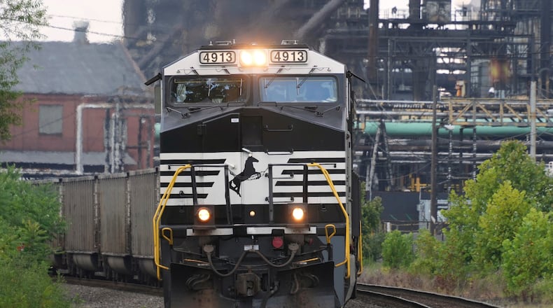 FILE - A Norfolk Southern freight train rolls past the U.S. Steel's Clairton Coke Works, in Clairton, Pa., Aug. 12, 2025. (AP Photo/Gene J. Puskar, File)