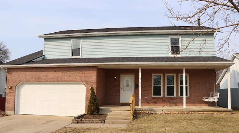 The 4-bedroom home offers about 2,070 sq. ft. of living space on a full, unfinished basement. The 2-story has updated flooring, interior doors, countertops, and interior paint. CONTRIBUTED PHOTO BY KATHY TYLER
