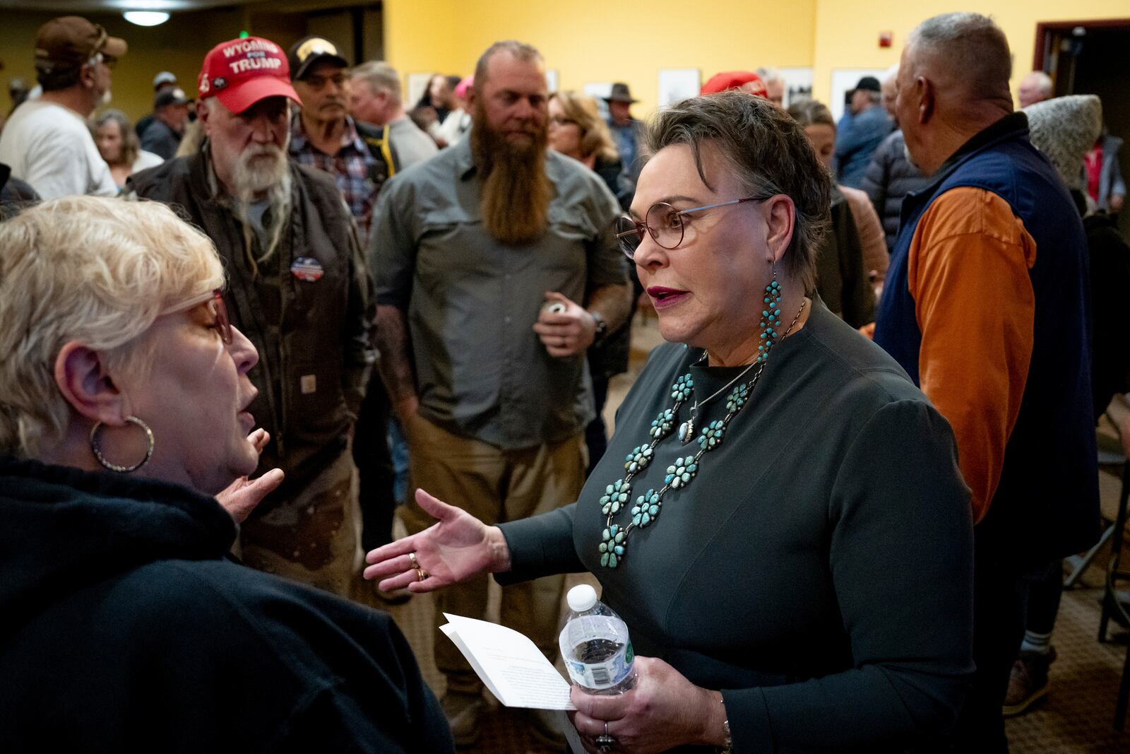 FILE - Rep. Harriet Hageman, R-Wyo., talks to attendees after holding a town hall meeting, March 14, 2025, in Evanston, Wyo. (AP Photo/Spenser Heaps, File)
