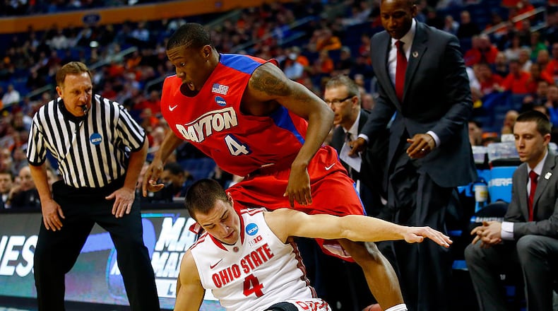 BUFFALO, NY - MARCH 20: Jordan Sibert #24 of the Dayton Flyers and Aaron Craft #4 of the Ohio State Buckeyes battle for a loose ball during the second round of the 2014 NCAA Men’s Basketball Tournament at the First Niagara Center on March 20, 2014 in Buffalo, New York. (Photo by Jared Wickerham/Getty Images)