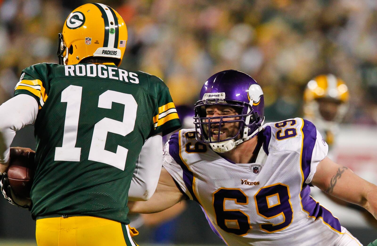 FILE - Minnesota Vikings defensive end Jared Allen sacks Green Bay Packers quarterback Aaron Rodgers during an NFL football game Monday, Nov. 14, 2011, in Green Bay, Wis. (AP Photo/Matt Ludtke, File)