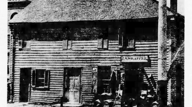 Historic Newcom Tavern, built in 1796, had its logs covered in this 1894 photograph.