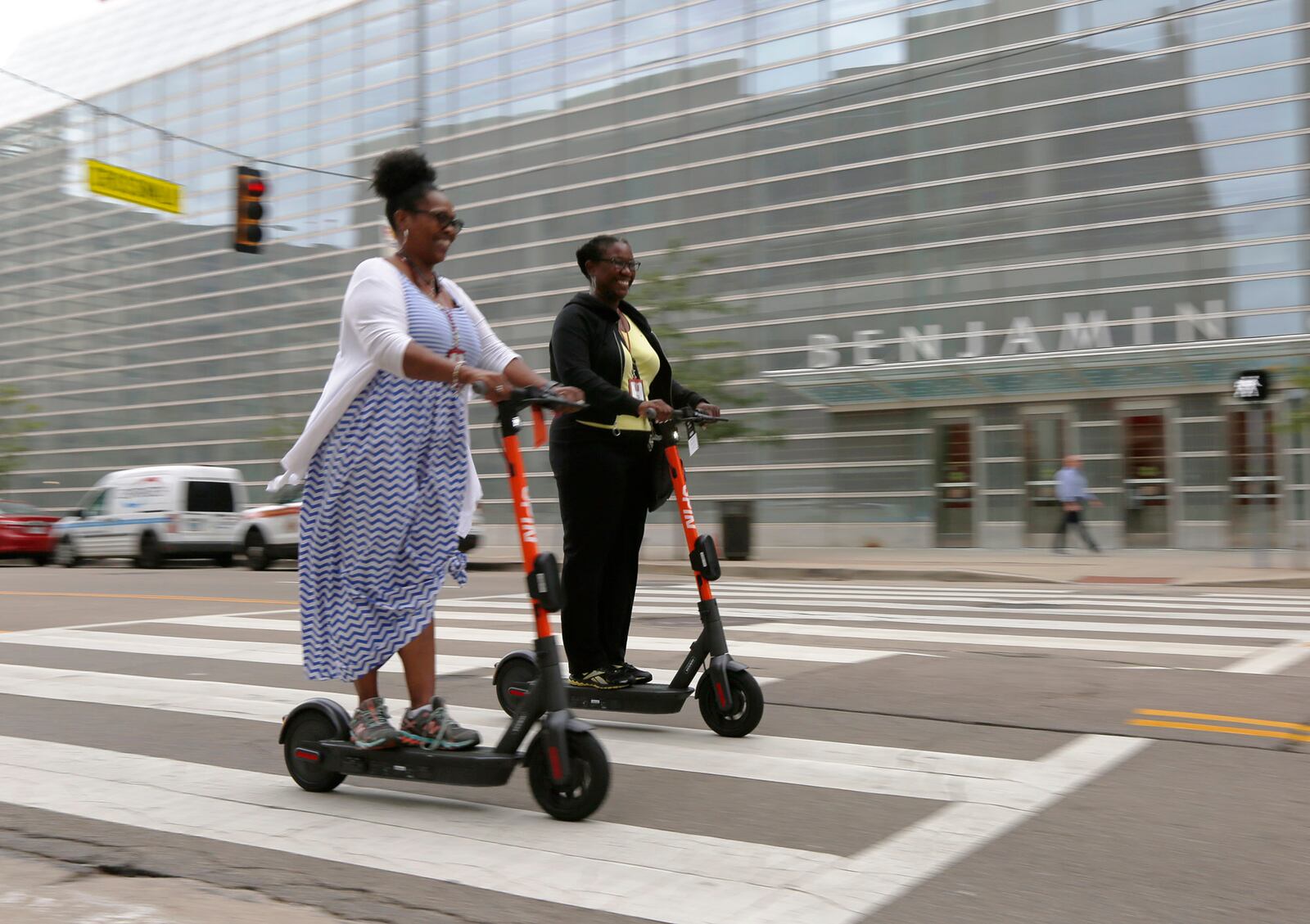 Greater Dayton  RTA held a launch party to introduce scooters to the city of Dayton. Spin Electric Scooters were available for test rides at Courthouse Square on Wednesday. Dayton residents, civic leaders, Dayton Police and Fire Department members rode the scooters a few blocks around downtown Dayton. Sheila Back, left, and Lettia,Younger, ride east on Second Street.  TY GREENLEES / STAFF