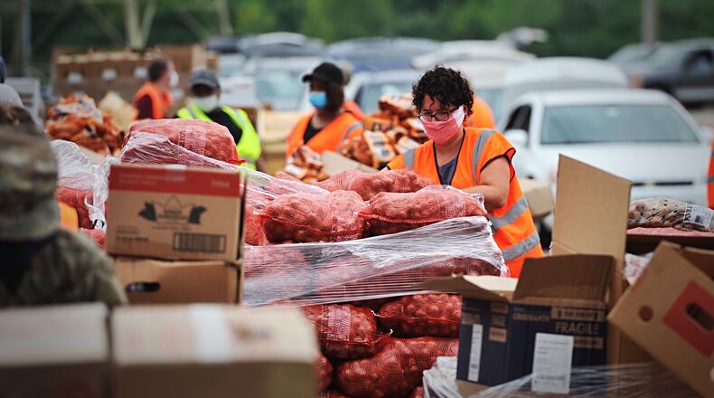 The Foodbank hosted a mass food distribution at Wright State's Nutter Center on Thursday, July 23, 2020. MARSHALL GORBY/STAFF