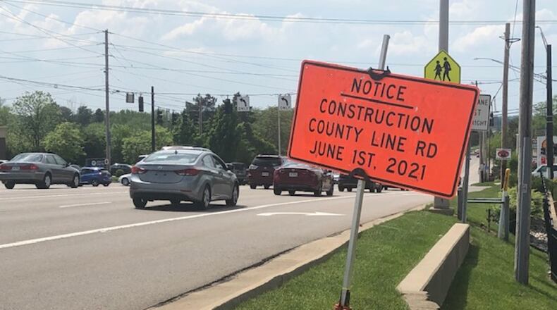 A sign has been put near County Line Road in Kettering as the widening is expected to start in June. NICK BLIZZARD/STAFF