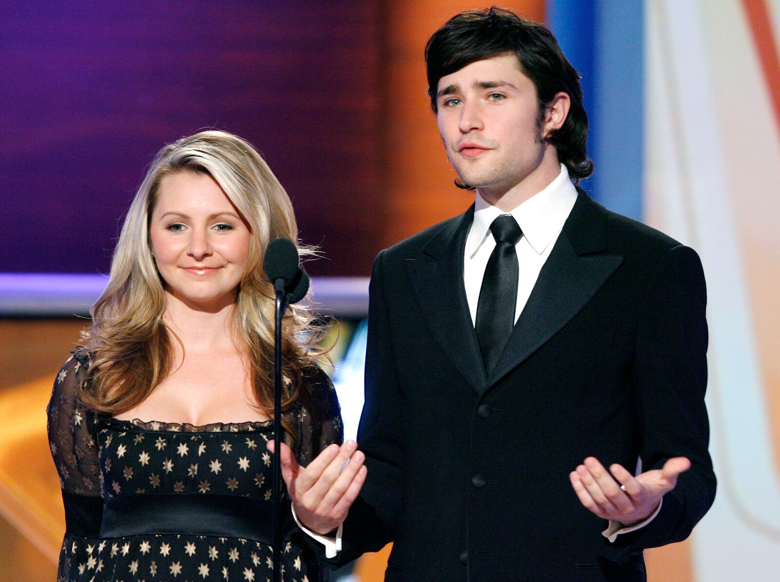 Actors Beverley Mitchell, left, and Matt Dallas present the award for Favorite Father/Daughter at the Family Television Awards in Beverly Hills, Calif., on Wednesday, Nov. 29, 2006. (AP Photo/Matt Sayles) ORG XMIT: CAMW113