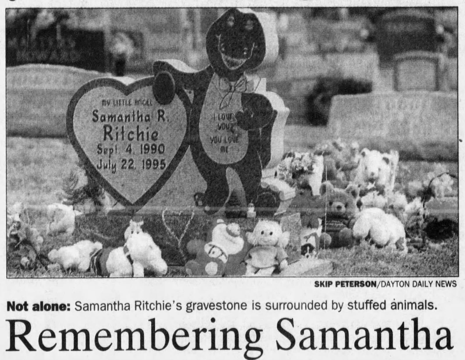Samantha Ritchie's gravestone, decorated with a Barney the dinosaur stuffed animal, from one of her favorite shows. DAYTON DAILY NEWS ARCHIVES.