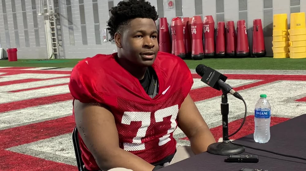 Ohio State offensive lineman Tegra Tshabola talks to reporters Monday in Columbus. Marcus Hartman/STAFF