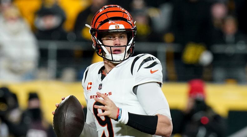 Cincinnati Bengals quarterback Joe Burrow (9) looks to throw during the first half of an NFL football game against the Pittsburgh Steelers Saturday, Jan. 4, 2025, in Pittsburgh. (AP Photo/Matt Freed)