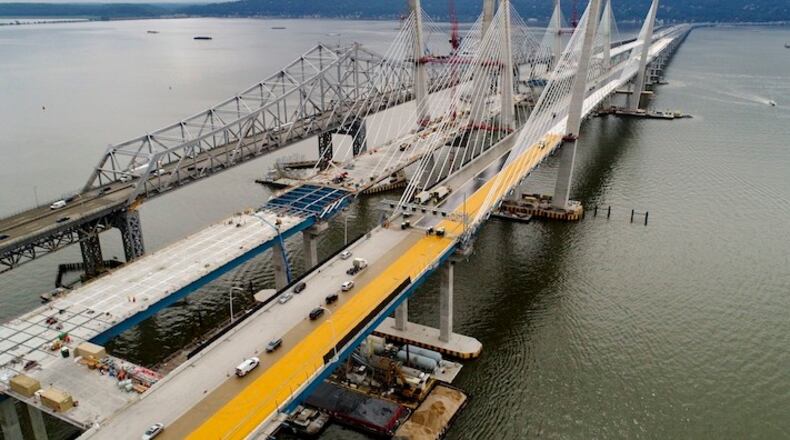 In this July 25, 2017 file photo, construction continues on the spans of the new Governor Mario M. Cuomo Bridge, right, as vehicles make their way on the the Tappan Zee Bridge over the Hudson River, near Tarrytown, N.Y. President Donald Trump's road to getting legislation through Congress this year to restore the nation's crumbling infrastructure appears increasingly precarious. (AP Photo/Julie Jacobson, File)