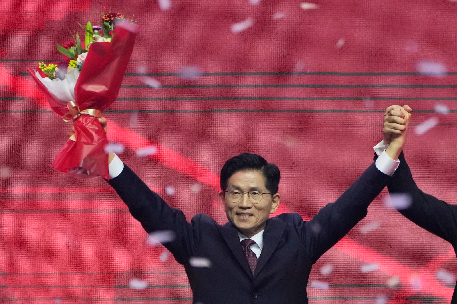 South Korea's former Labor Minister Kim Moon Soo celebrates after winning the nomination as the presidential election candidate during the People Power Party's convention in Goyang, South Korea, Saturday, May 3, 2025. (AP Photo/Ahn Young-joon)