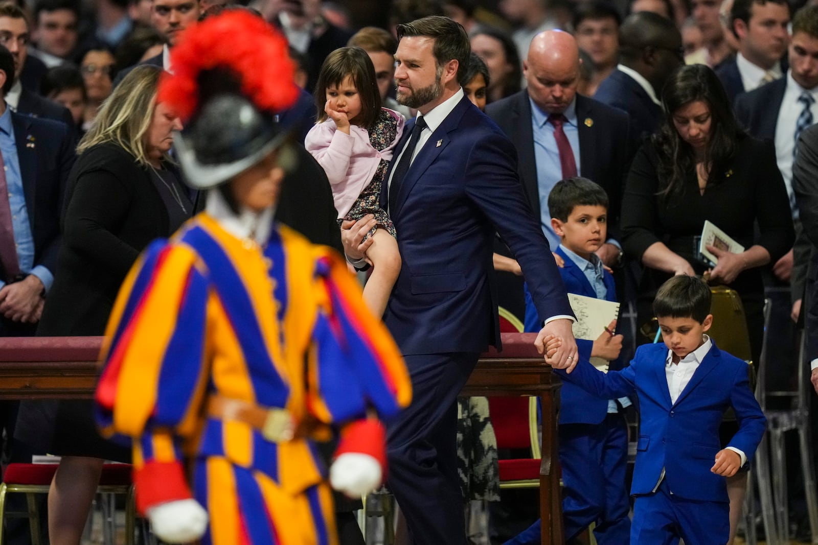 U.S. Vice President JD Vance, with, from left, daughter Mirabel, sons Ewan and Vivek leave at the end of a Good Friday service inside St. Peter's Basilica at the Vatican, Friday, April 18, 2025. (AP Photo/Alessandra Tarantino)
