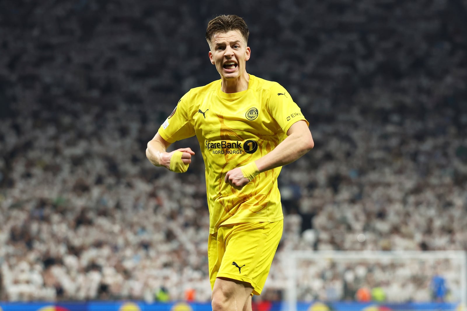 Glimt's Jostein Gundersen celebrates his side's first goal during the Europa League semifinal first leg soccer match between Tottenham Hotspur and Bodo/Glimt at the White Hart Lane stadium in London, Thursday, May 1, 2025. (AP Photo/Ian Walton)