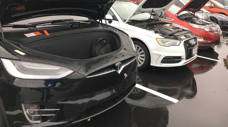 Various types of electric vehicles sit in the parking lot of the University of Dayton's Research Institute Tuesday during a Clean Fuels Ohio showcase. Steve Maguire/Staff
