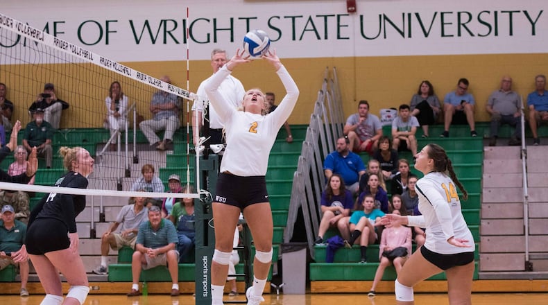 Wright State’s Lainey Stephenson (2) sets the ball to teammate Teddie Sauer during an exhibition match against Ohio University last month. The Raiders opened their season with a win at Notre Dame. PHOTO COURTESY OF WRIGHT STATE ATHLETICS