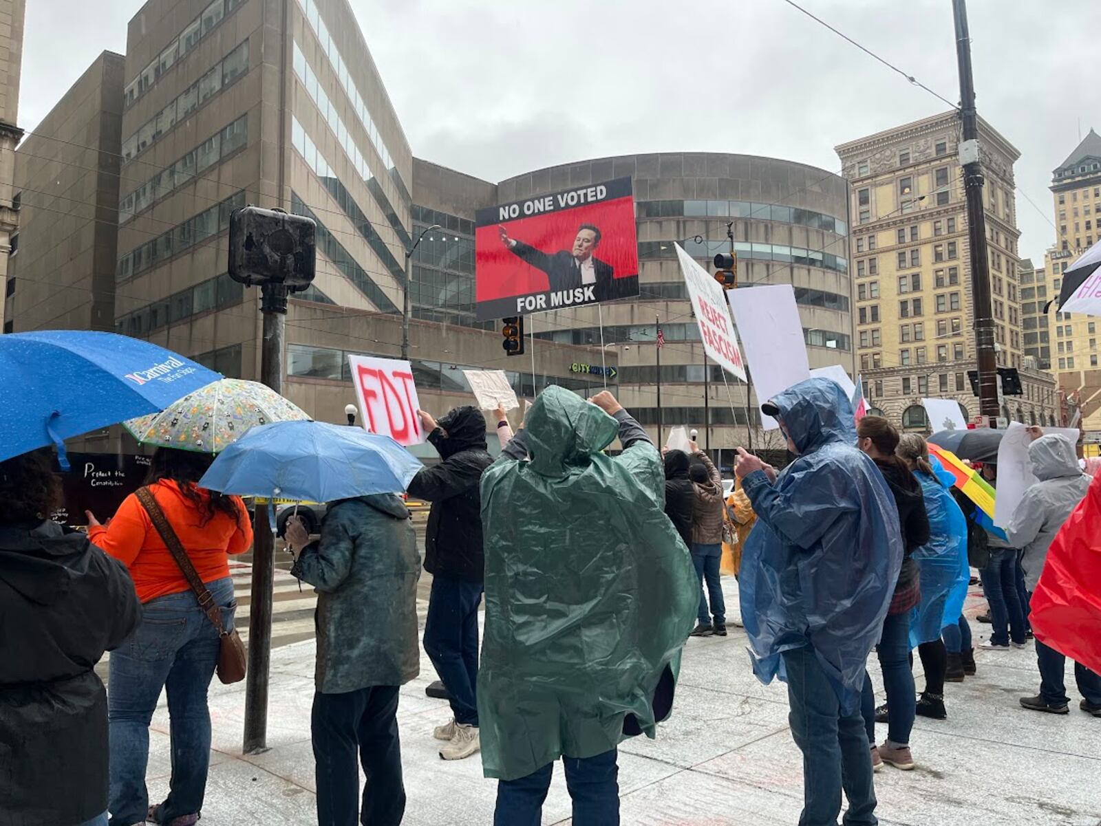 Protestors brought plenty of signs to Courthouse Square Saturday afternoon. THOMAS GNAU/STAFF