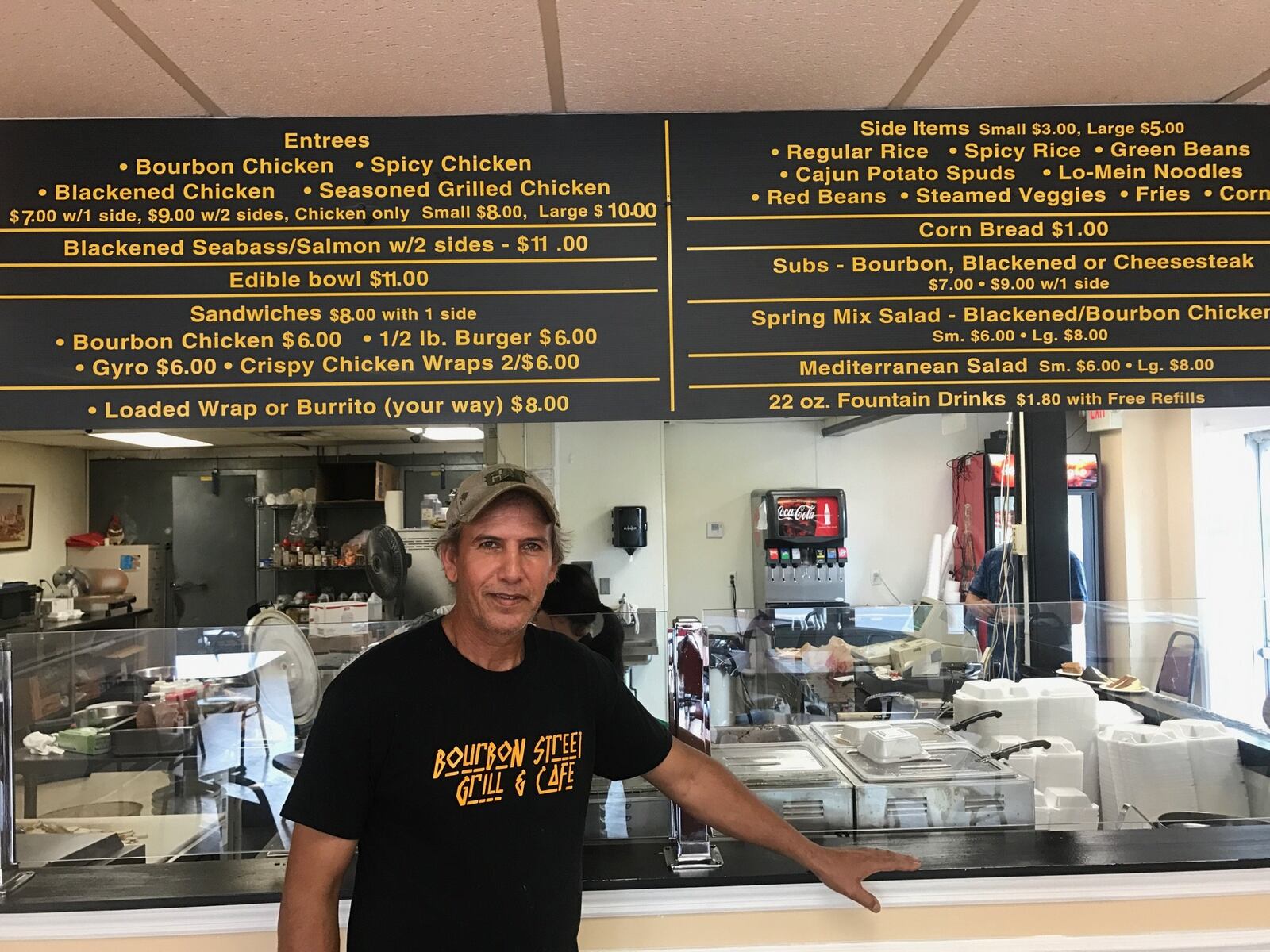 Hassan Abdalla, owner of the Bourbon Street Grill & Cafe, at his restaurant Saturday afternoon. Abdalla, who was born in Libya, is helping the First Dayton Little League (FDLL) program in West Dayton. The program has struggled to find enough finances and volunteers in recent years. TOM ARCHDEACON / STAFF
