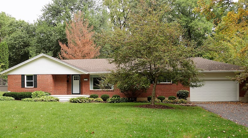 The brick ranch, with about 2,530 sq. ft. of finished living space, features 3 bedrooms, 3 full updated bathrooms, original hardwood flooring and has a finished basement for multiple-use living space. CONTRIBUTED PHOTO BY KATHY TYLER